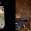 Antigo frasco de perfume romano e interior de tumba funerária