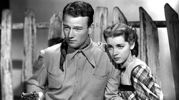 John Wayne e Marsha Hunt em “Trunfos na Mesa” (1937) - Divulgação/Paramount Pictures