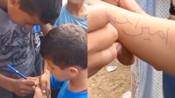 Imagens das crianças palestinas escrevendo seus nomes no corpo - Reprodução/Vídeo/X/AminaaKausar