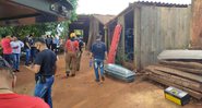 Autoridades em residência onde os corpos foram encontrados - Divulgação/Polícia Nacional Paraguai