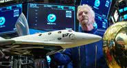 Richard Branson junto de uma representação das espaçonaves da Virgin Galactic - Getty Images
